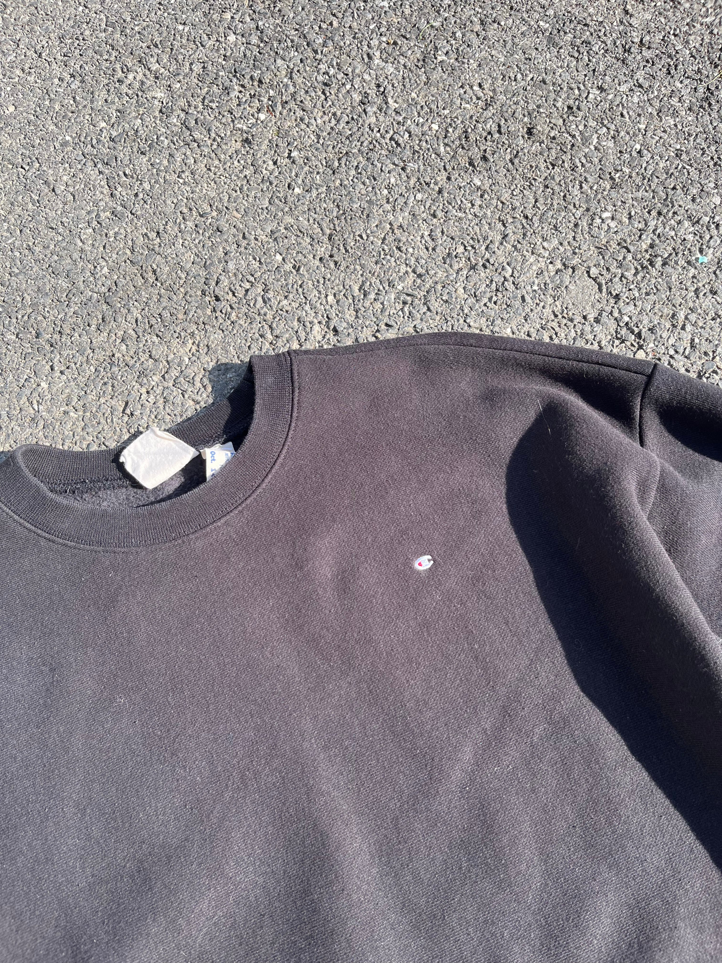 SWEAT CHAMPION NOIR AVEC MINI LOGO